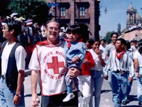 Lane Simmons in Red Cross Shirt and son Pancho – Best Places In The World To Retire – International Living