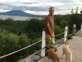 Chuck Bolotin on malecon in Jocotepec, with Lake Chapala and Garcia in the distance – Best Places In The World To Retire – International Living