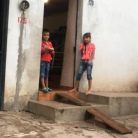 Two children standing outside their home in Jocotepec – Best Places In The World To Retire – International Living