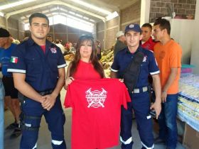 Alicia Gomez with very protective men, firement, the bomberos of Lakeside, Lake Chapala, Mexico – Best Places In The World To Retire – International Living