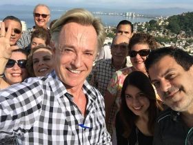 Carl Timothy taking a selfing with his real estate staff in Puerto Vallarta, Mexico – Best Places In The World To Retire – International Living