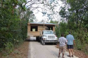 Ed Parish's home being delivered to his lot, Corozal, Belize – Best Places In The World To Retire – International Living