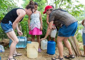 Elisha MacCay getting potable water after Hurricane Nate in Nicaragua – Best Places In The World To Retire – International Living