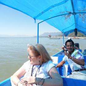 Expats and Mexican nationals enjoying a boat tour on Lake Chapala, Mexico – Best Places In The World To Retire – International Living