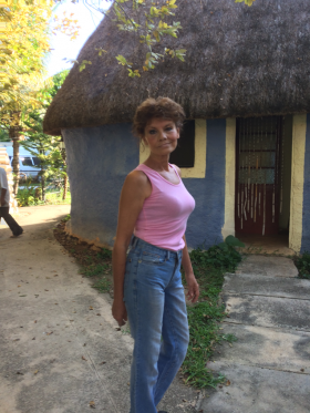 Iona Chamberlain next to the original caretaker's home on her property at Hacienda Nohpat San Pedro, near Merida, Mexico – Best Places In The World To Retire – International Living