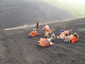 (Sand sledding with Cobb family on slopes of Nicaraguan volcano, pictured.) – Best Places In The World To Retire – International Living