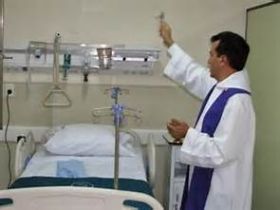Priest blessing a room in a hospital in Guadalajara, Mexico – Best Places In The World To Retire – International Living