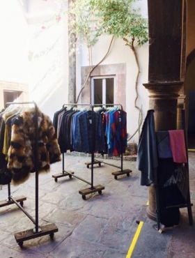 Racks of clothes in the courtyard for Hoja Santa boutique, San Miguel de Allende, Mexico – Best Places In The World To Retire – International Living