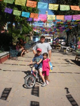 Thomas Hellyer with his kids exploring downtown Chapala, Mexico – Best Places In The World To Retire – International Living