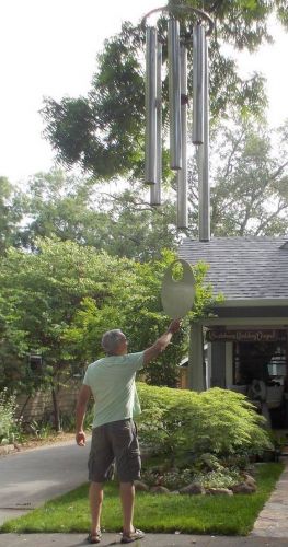 Chuck Bolotin ringing the giant wind chime