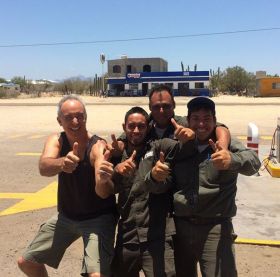 Chuck Bolotin with Pemex attendants in Baja California Sur