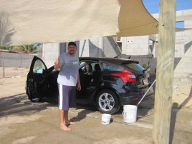 Iran giving thumbs up at carwash in La Ventana Bay, Baja Sur, Mexico