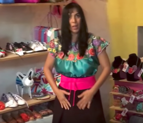 Jet Metier tries on a dress in Puebla from Chipas – Best Places In The World To Retire – International Living