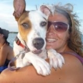 Kate Corrigan with her dog in Belize