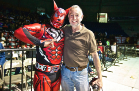 Luche libre (wrestling in Mexico) with Gary Coles with a wrestler – Best Places In The World To Retire – International Living