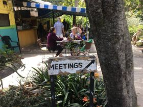 Sign pointing to meetings at Lake Chapala Society LCS