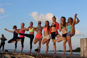 Yoga on the pier at Crimson Orchid Inn, Corozal, Belize – Best Places In The World To Retire – International Living