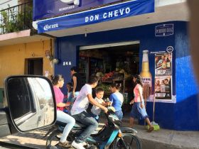 Young family on their motorcycle in Mexico street