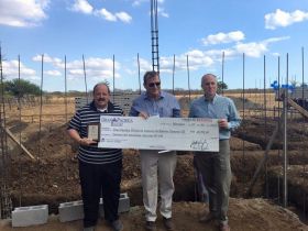 Dr. Carl Ross, Joel Nagel, Mike Cobb displaying check for clinic (left to right) – Best Places In The World To Retire – International Living